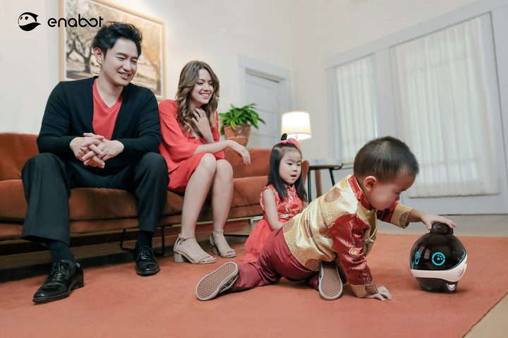 The EBO X robot interacting with a family.