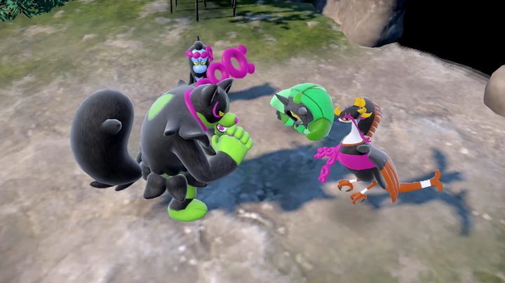 Four Pokémon standing in a circle in Pokémon dlc.
