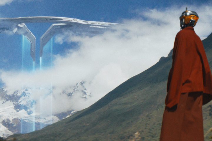 An AI monk looks up at the Nomad space station in The Creator.