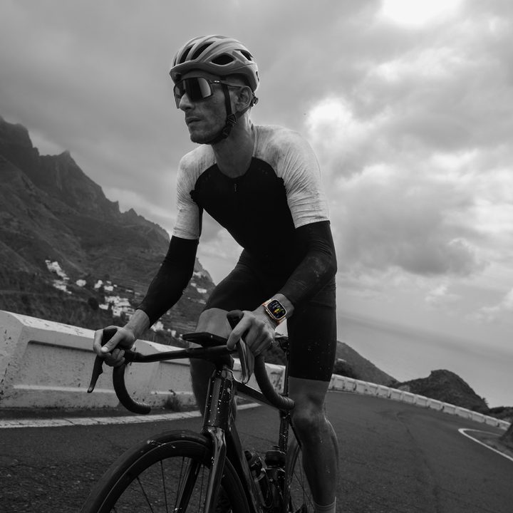 A person cycling while wearing an Apple Watch Ultra 2