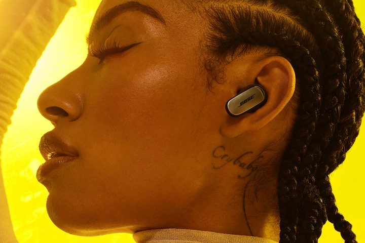 Woman wearing Bose QuietComfort Ultra Earbuds.