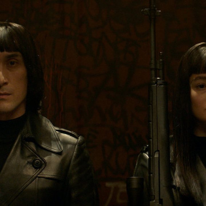 Mark Musashi and Marina Mazepa stand side-by-side in an elevator.