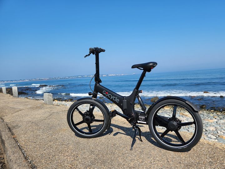 The GoCycle G4 folding e-bike parked by the Atlantic Ocean