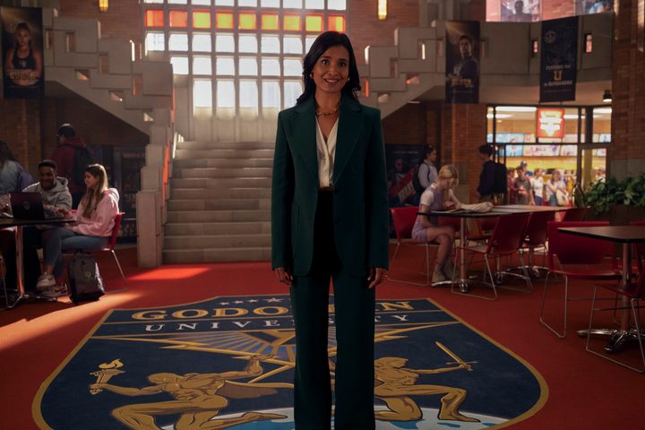 Indira Shetty stands in a college common room in Gen V.