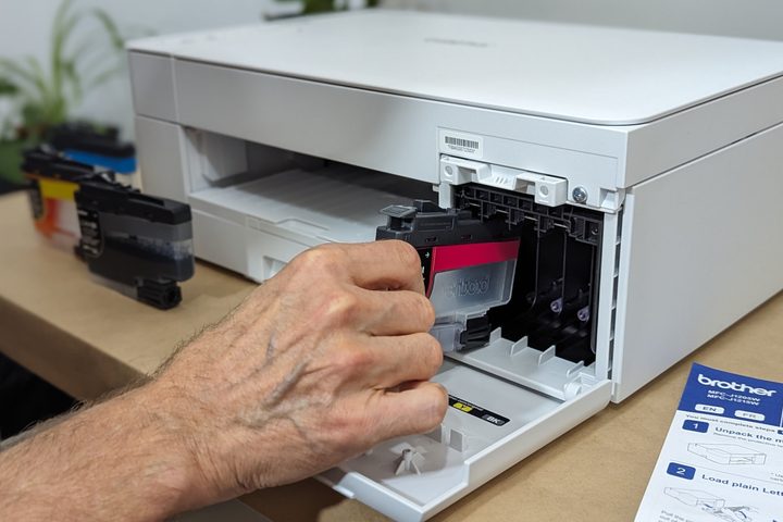 Installing the Brother MFC-J1205W's large ink cartridges.