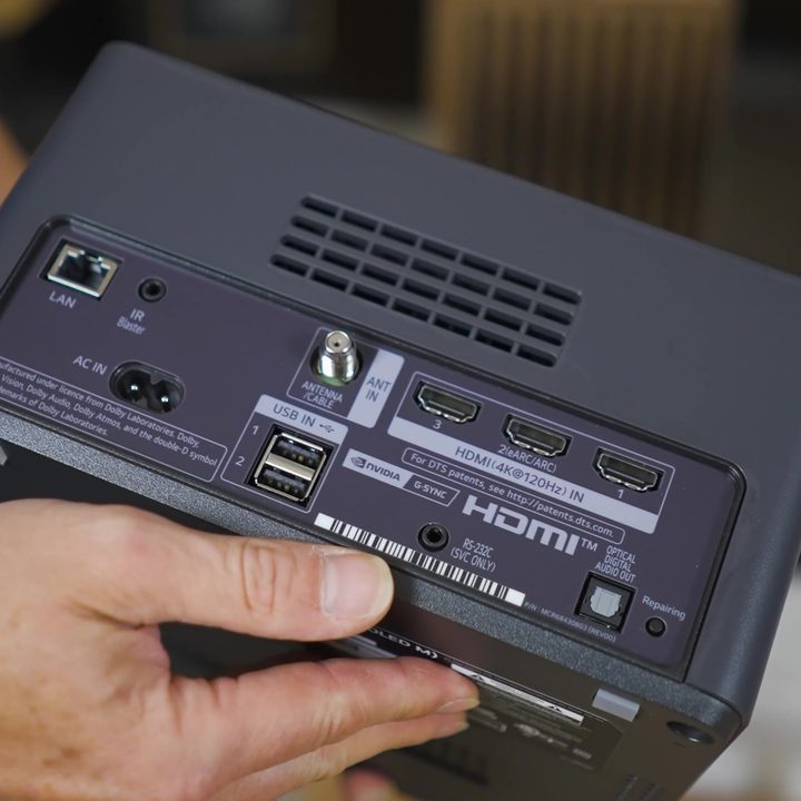 Port selection on the back of the LG M3 Wireless OLED box.