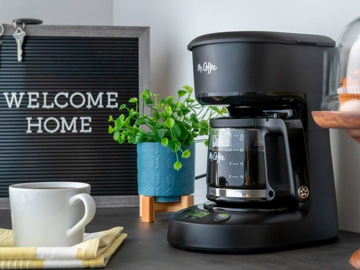 The Mr. Coffee 5-cup coffee maker on a kitchen stand.
