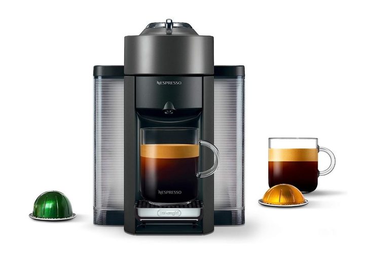 The Nespresso Vertuo displayed with cups, coffee, and pods.