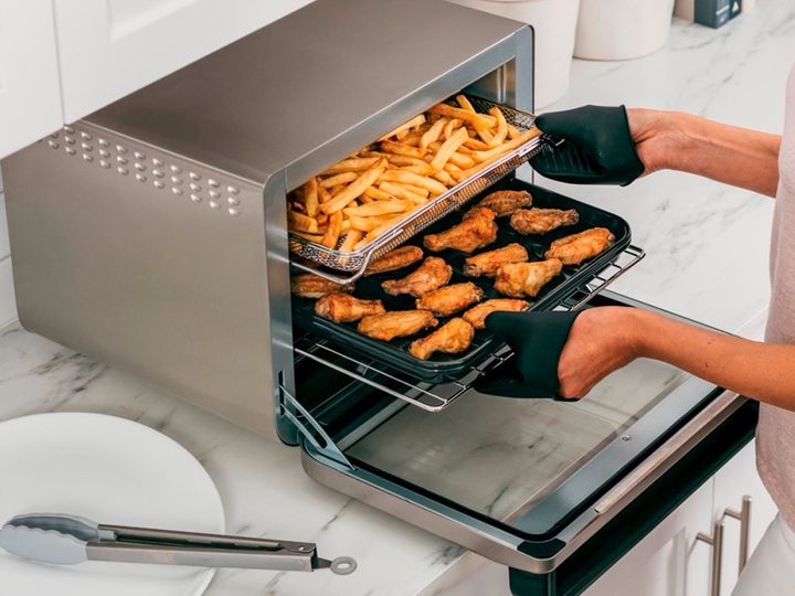 Unloading food from the Ninja Foodi 10-in-1 Smart XL.