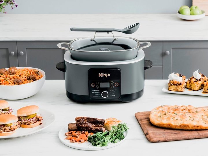 The Ninja Foodi PossibleCooker Pro on a counter with a meal.