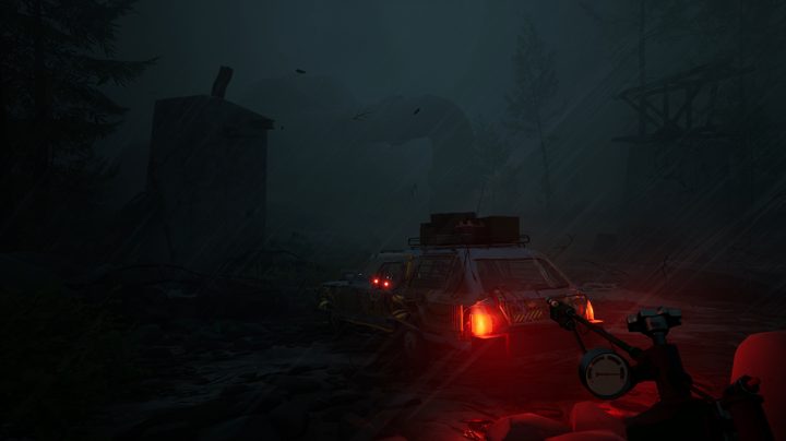 A dark and stormy night is illuminated by the tail lights of a salvaged station wagon.