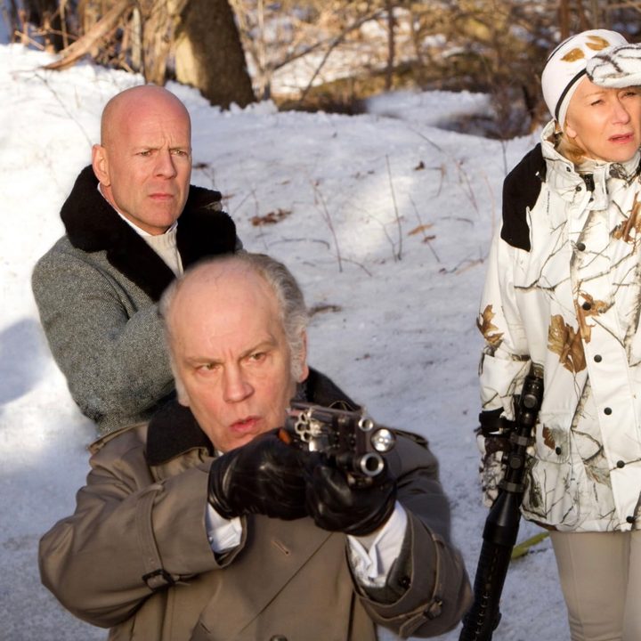 Three people hold guns in the snow in Red.
