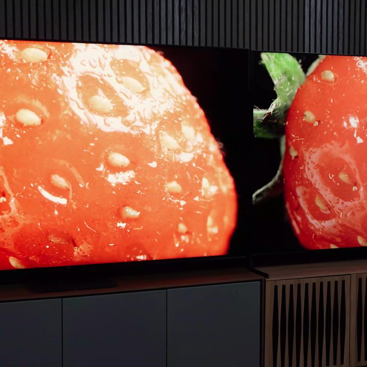 Side-by-side comparison of a close-up of a strawverry on a Sony Bravia X95L vs TCL QM8.