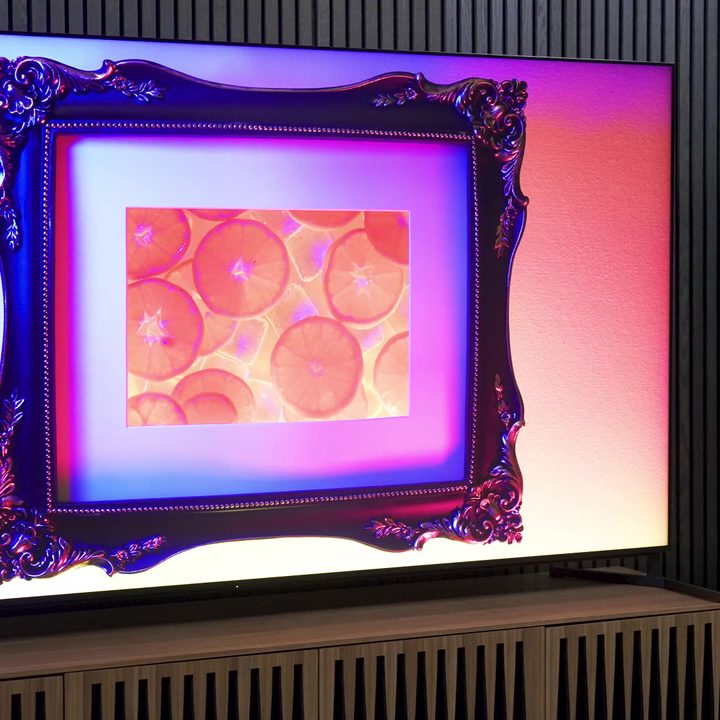 An image of a framed picture of citrus fruit is shown on a Sony X95L mini-LED.