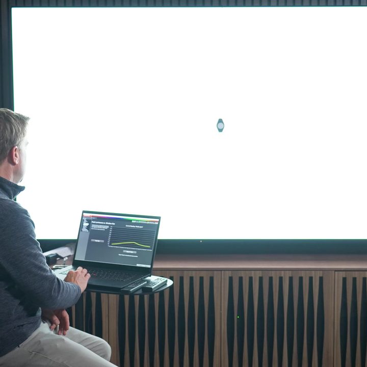 A man measures brightness on a Sony X95L mini-LED.