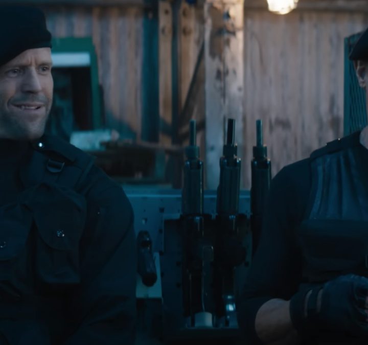 Jason Statham and Sylvester Stallone stand next to each other Expend4bles.