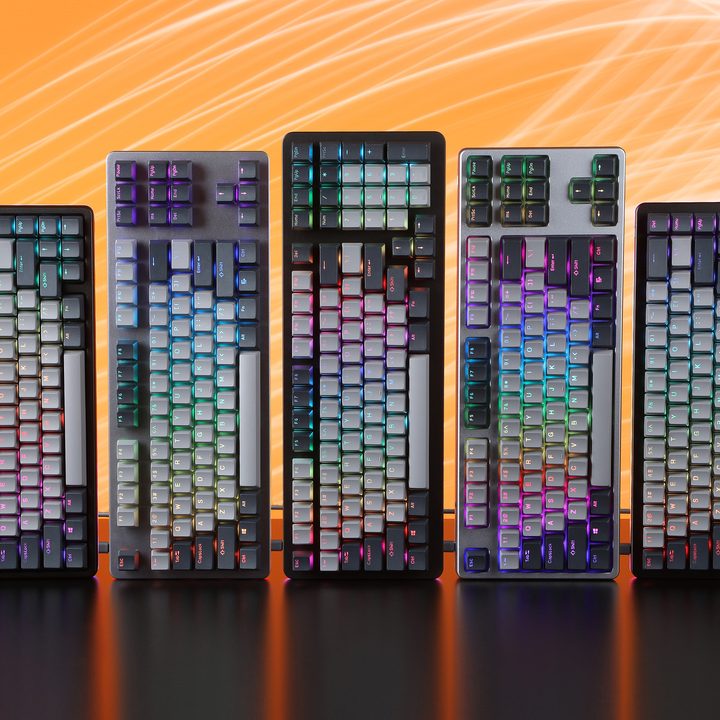 Five Drop keyboards stand next to each other over an orange background.