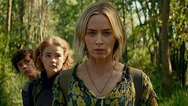 Evelyn from "A Quiet Place Part II" looking determined, her kids behind her.