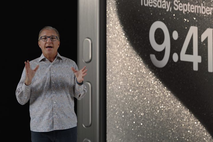 Apple SVP Greg "Joz" Joswiak presenting the iPhone 15 Pro action button during Apple's September 2023 iPhone event.