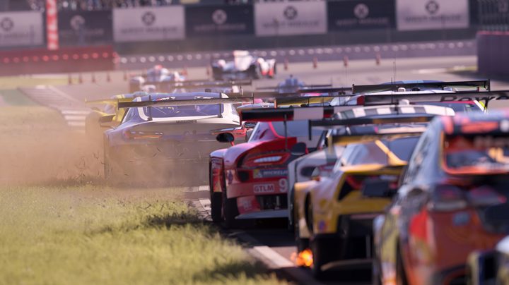 Cars race on the side of a track in Forza Motorsport.