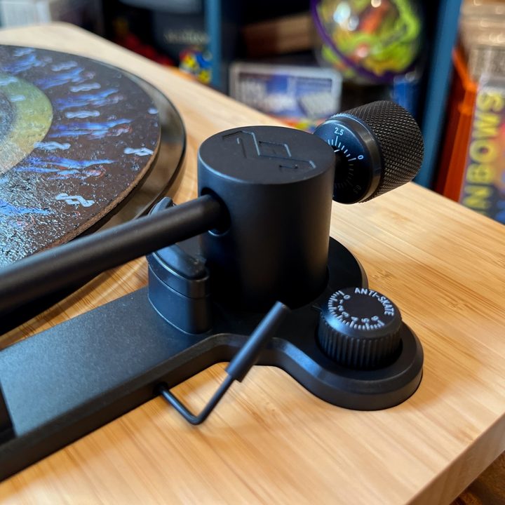 The tonearm and counterweight assembly of the House of Marley Stir It Up Lux Bluetooth turntable.