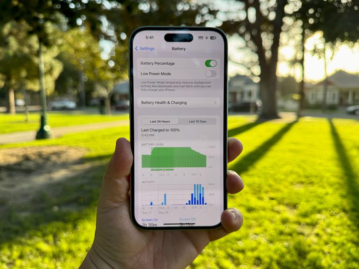 A green iPhone 15 showing battery life.