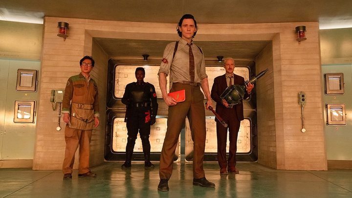 Loki stands with 3 people behind him in Loki season 2.