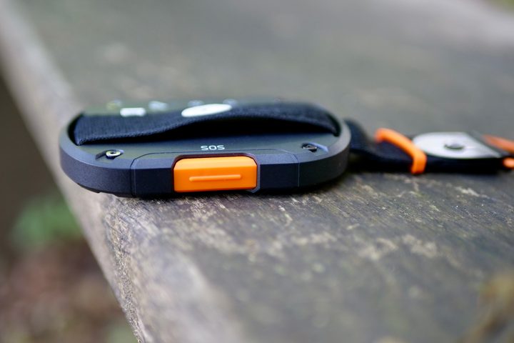 The orange SOS button on the side of the Motorola Defy.