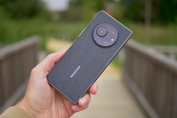 A person holding the folded Tecno Phantom V Fold.