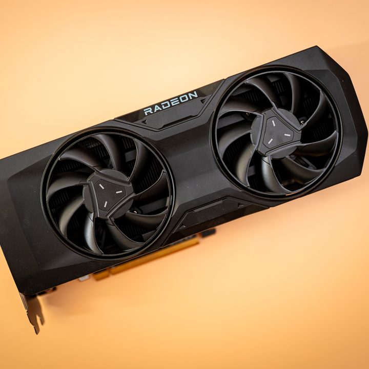 AMD RX 7800 XT graphics card on an orange background.