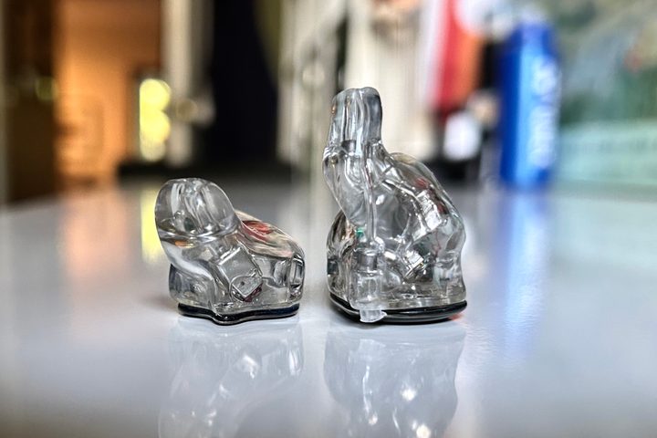 Ultimate Ears 5 Pro seen next to UE Premier wired IEM, no cables.