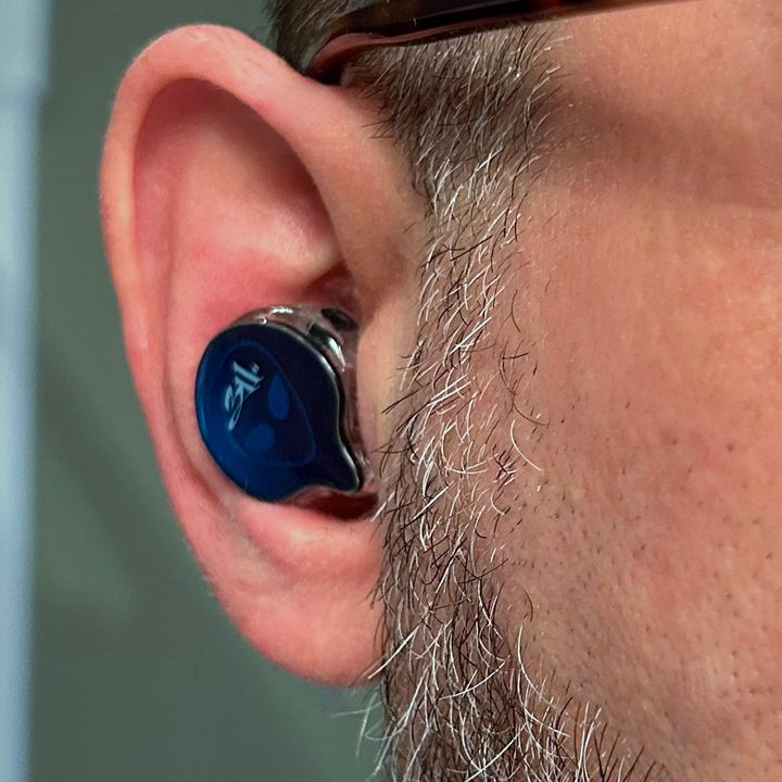 Simon Cohen wearing Ultimate Ears 5 Pro IEM with optional faceplate, no cable.