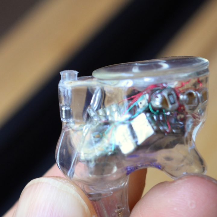 Close-up of a single Ultimate Ears Premier wired IEM without cable.