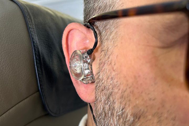 Front view of Simon Cohen wearing the Ultimate Ears Premier wired IEMs.