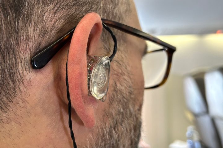 Rear view of Simon Cohen wearing the Ultimate Ears Premier wired IEMs.