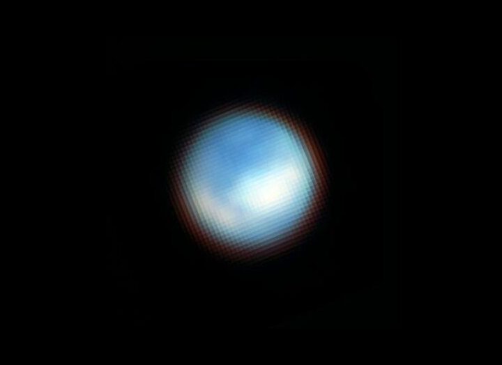 Webb’s NIRCam (Near Infrared Camera) captured this picture of the surface of Jupiter’s moon Europa. Webb identified carbon dioxide on the icy surface of Europa that likely originated in the moon’s subsurface ocean. This discovery has important implications for the potential habitability of Europa’s ocean. The moon appears mostly blue because it is brighter at shorter infrared wavelengths. The white features correspond with the chaos terrain Powys Regio (left) and Tara Regio (centre and right), which show enhanced carbon dioxide ice on the surface.