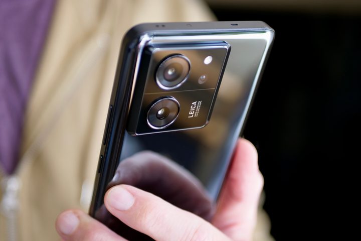 A person holding the Xiaomi 13T Pro, showing the camera module.