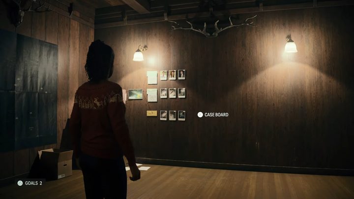 Saga looking at the case board.