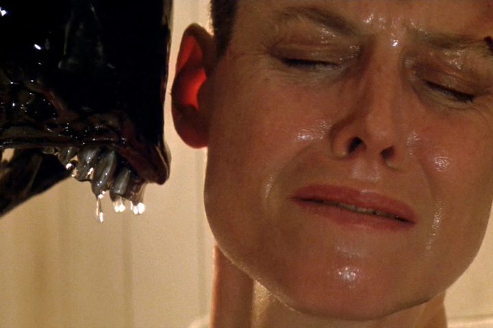 A Xenomorph snarls at Sigourney Weaver in Alien 3.