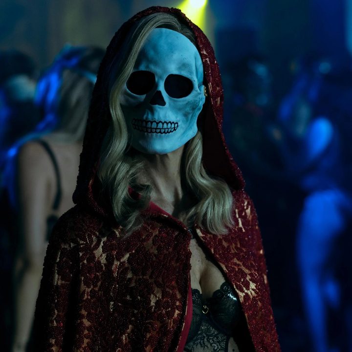A blonde-haired woman wears a skull mask in "The Fall of the House of Usher."