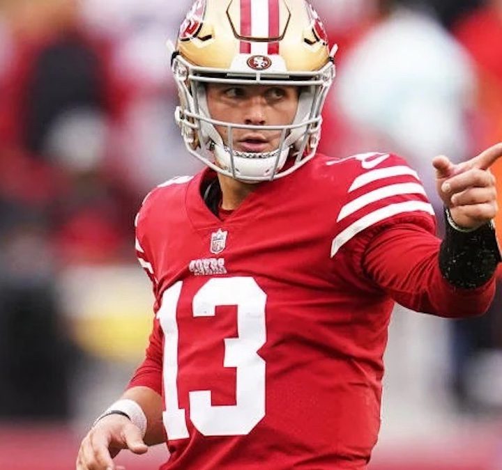 A football player points during a game.