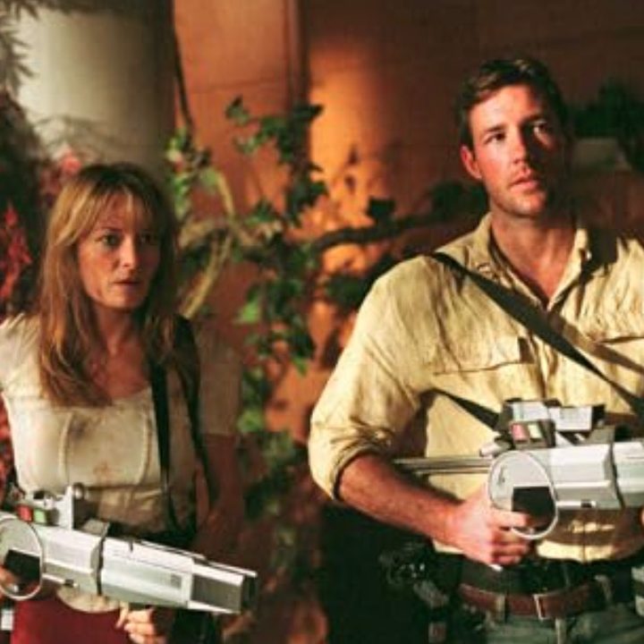 A woman and man hold guns in A Sound of Thunder.