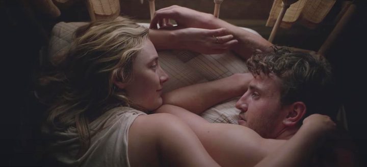 A man and a woman lie in bed in Foe.