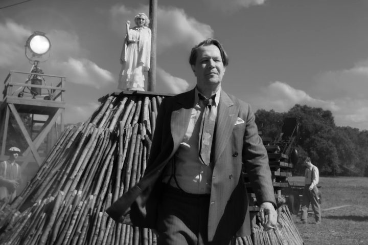 Gary Oldman walks away from Amanda Seyfried in Mank.