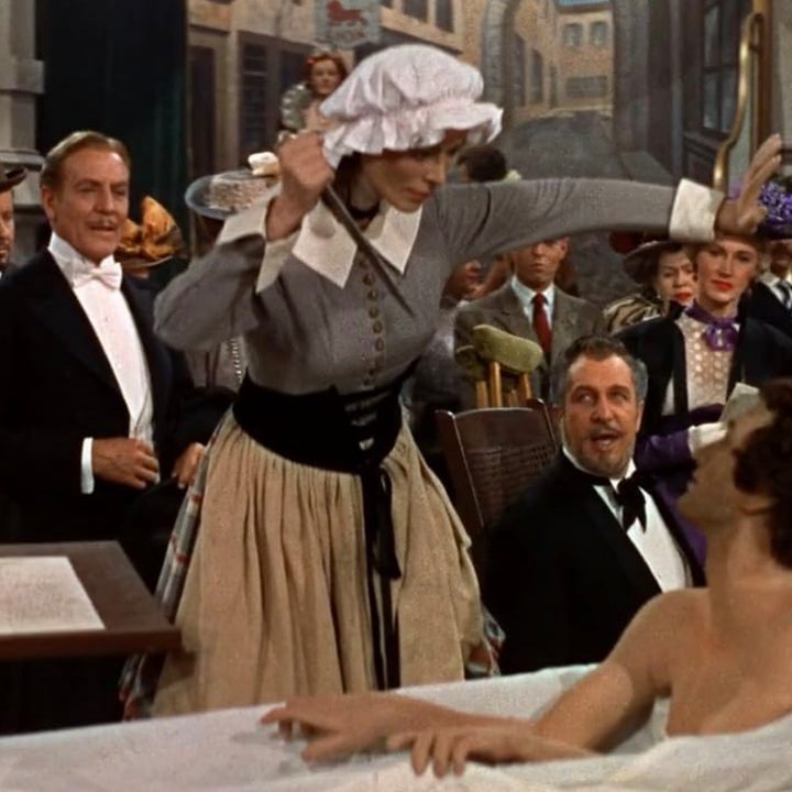 A wax statue stands in front of a crowd in House of Wax.