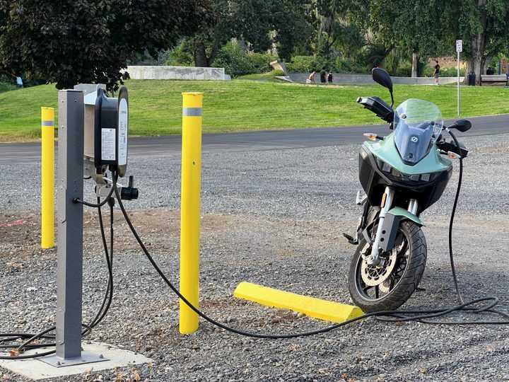 A 2023 Zero DSR-X motorcycle charges on a level 2 charger.