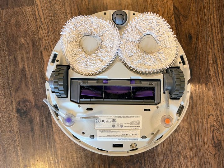 A Narwal robot is flipped on its back.