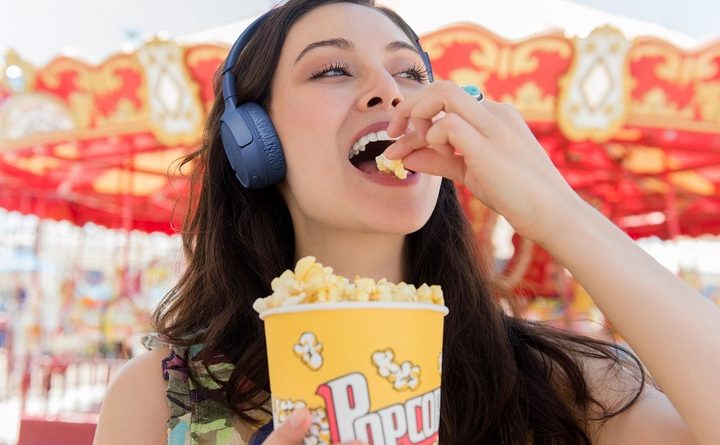 A woman wearing the JBL Tune 510BT headphones.