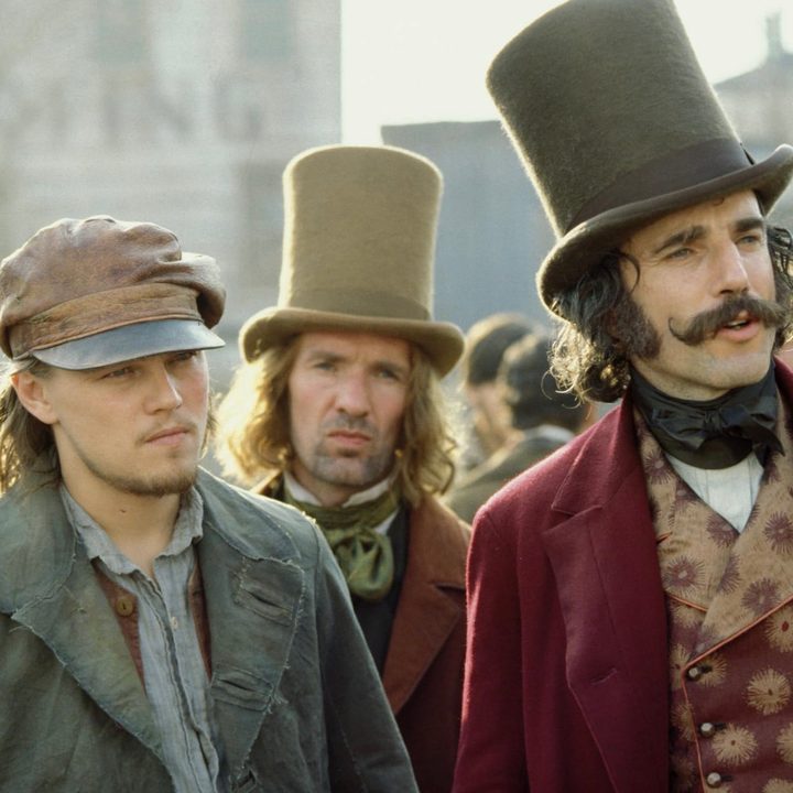 Two men stand next to each other and stare in. Gangs of New York.