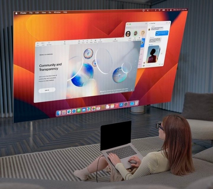 Virtual screens graphically shown in front of a woman on a couch.